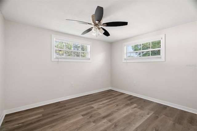 5122 Chet Dr, New Port Richey, FL 34652 - spare room with healthy amount of natural light, wood finished floors, baseboards, and a ceiling fan