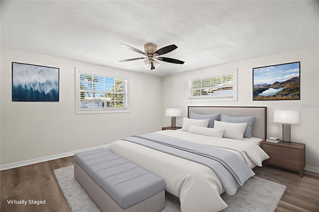 5122 Chet Dr, New Port Richey, FL 34652 - bedroom with baseboards, multiple windows, and wood finished floors