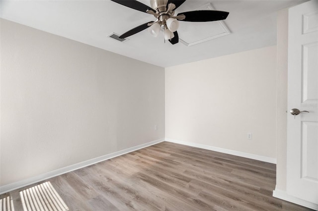 5122 Chet Dr, New Port Richey, FL 34652 - spare room with ceiling fan, wood finished floors, and baseboards