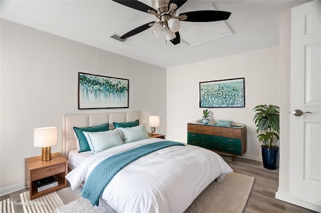 5122 Chet Dr, New Port Richey, FL 34652 - bedroom featuring wood finished floors, baseboards, ceiling fan, and attic access