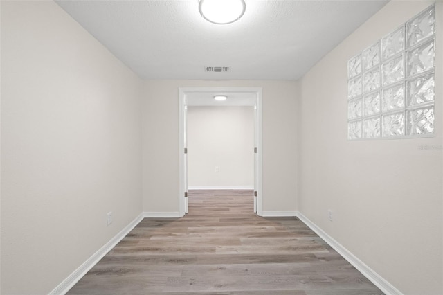 5122 Chet Dr, New Port Richey, FL 34652 - hallway with wood finished floors and baseboards