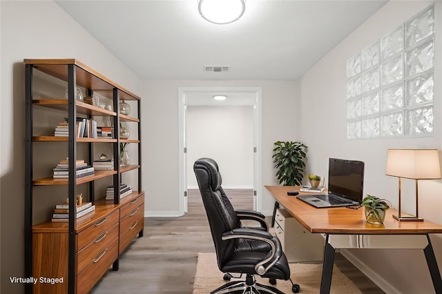 5122 Chet Dr, New Port Richey, FL 34652 - office area featuring light wood-type flooring and baseboards