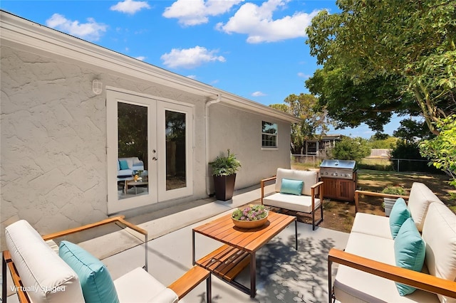 5122 Chet Dr, New Port Richey, FL 34652 - view of patio / terrace featuring french doors, an outdoor living space, and area for grilling