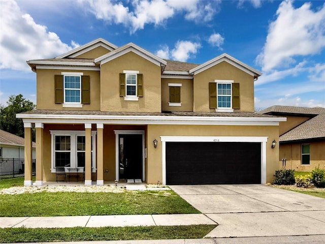 4916 Rolling Green Dr, Wesley Chapel, FL 33543 - traditional-style house with a porch, stucco siding, driveway, and a garage