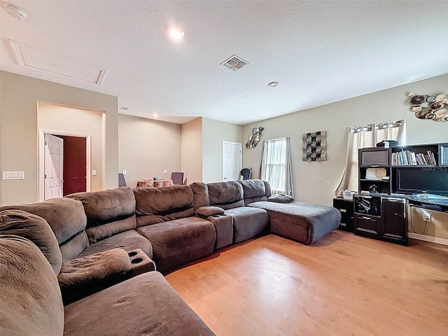 4916 Rolling Green Dr, Wesley Chapel, FL 33543 - living room featuring light wood finished floors, attic access, and recessed lighting