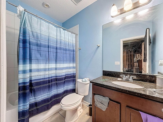 4916 Rolling Green Dr, Wesley Chapel, FL 33543 - full bath with toilet, vanity, tile patterned floors, a textured ceiling, and a textured wall
