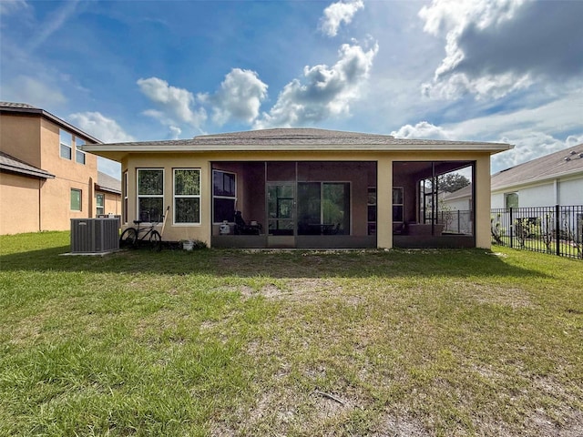 4916 Rolling Green Dr, Wesley Chapel, FL 33543 - rear view of house featuring a sunroom, central air condition unit, and stucco siding