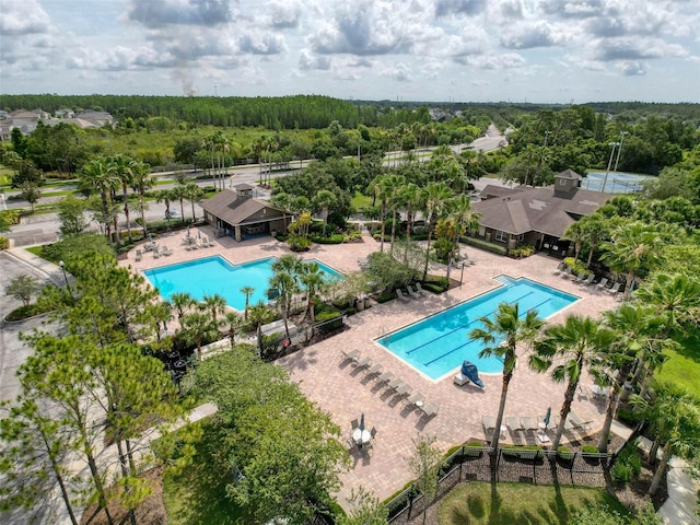 4916 Rolling Green Dr, Wesley Chapel, FL 33543 - bird's eye view of a pool area and a forest