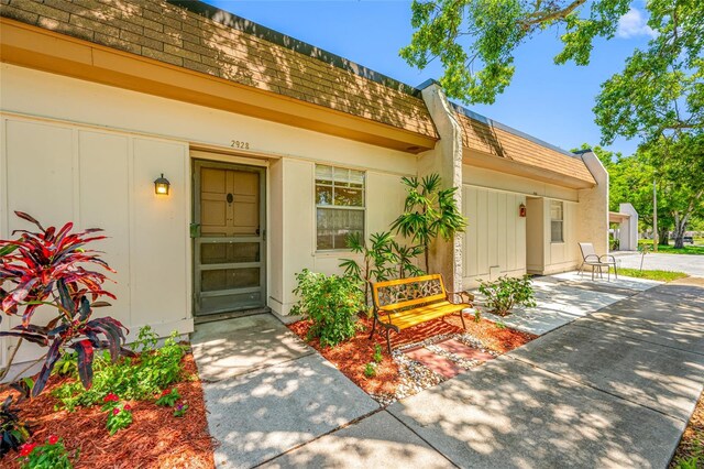 2928 Feather Dr, Clearwater, FL 33759 - entrance to property with mansard roof and roof with shingles