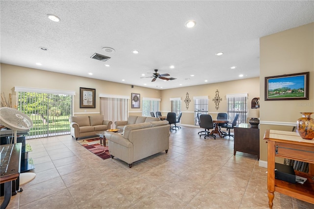 2928 Feather Dr, Clearwater, FL 33759 - living area with a textured ceiling, a ceiling fan, recessed lighting, and light tile patterned flooring