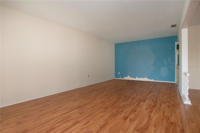 1009 Andover Cir, Sun City Center, FL 33573 - spare room with light wood-style flooring and baseboards