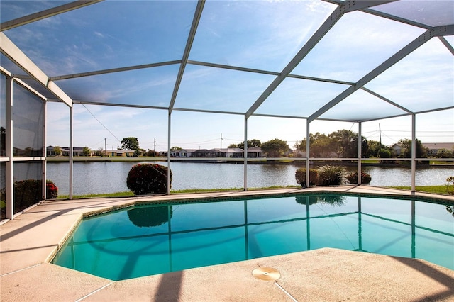 1009 Andover Cir, Sun City Center, FL 33573 - swimming pool with a water view, glass enclosure, and a patio