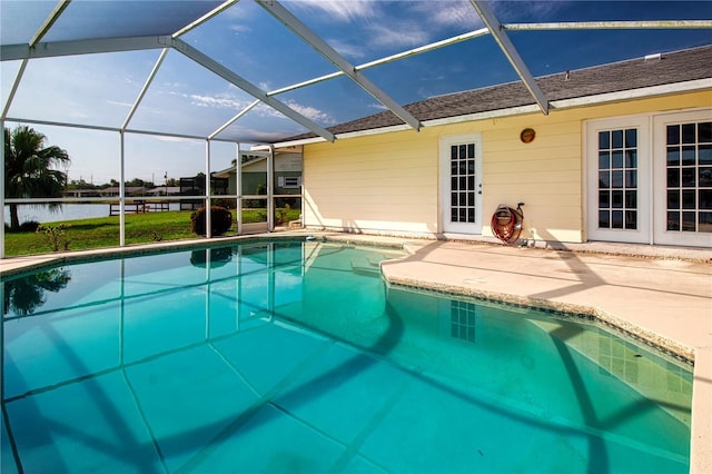 1009 Andover Cir, Sun City Center, FL 33573 - swimming pool with a water view, a patio area, and glass enclosure
