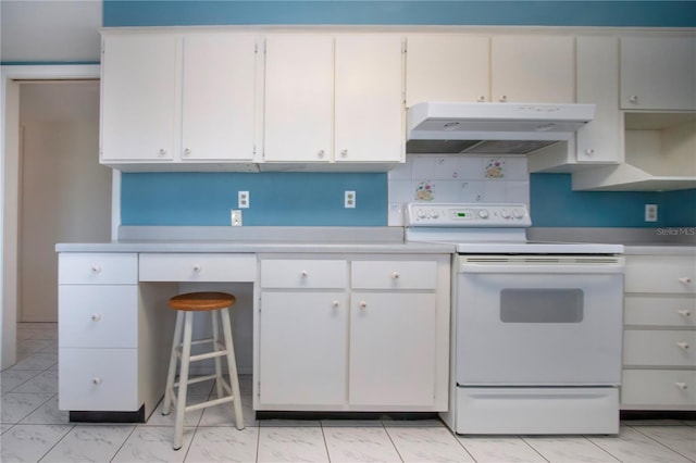 1009 Andover Cir, Sun City Center, FL 33573 - kitchen with white electric range oven, under cabinet range hood, light countertops, light marble finish floors, and white cabinets
