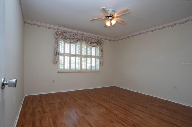 1009 Andover Cir, Sun City Center, FL 33573 - spare room with a ceiling fan, wood finished floors, baseboards, and crown molding