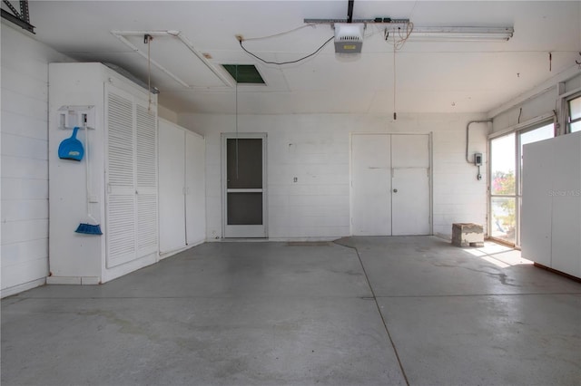 1009 Andover Cir, Sun City Center, FL 33573 - garage featuring a garage door opener