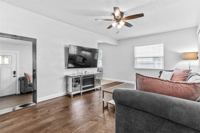 4531 7th Ave N, Saint Petersburg, FL 33713 - living room with a ceiling fan, plenty of natural light, wood finished floors, and baseboards