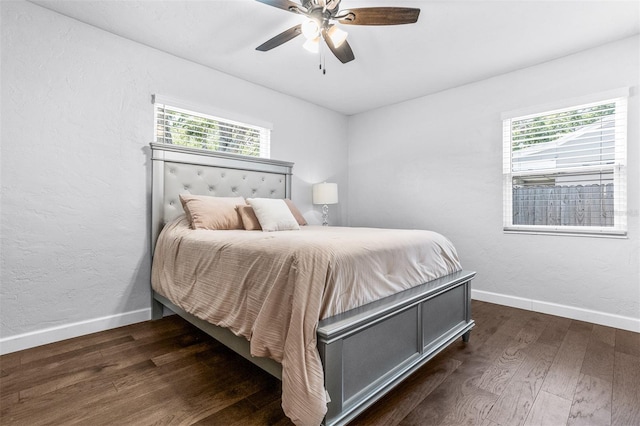 4531 7th Ave N, Saint Petersburg, FL 33713 - bedroom with multiple windows, wood finished floors, baseboards, ceiling fan, and a textured wall