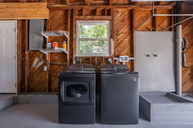 4531 7th Ave N, Saint Petersburg, FL 33713 - washroom featuring electric panel, washing machine and dryer, and wooden walls