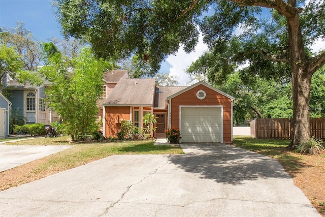 9466 Forest Hills Cir, Tampa, FL 33612 - view of front facade with asphalt driveway and an attached garage