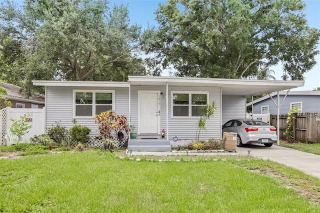 1015 13th Ave NW, Largo, FL 33770 - view of front of home with concrete driveway and an attached carport