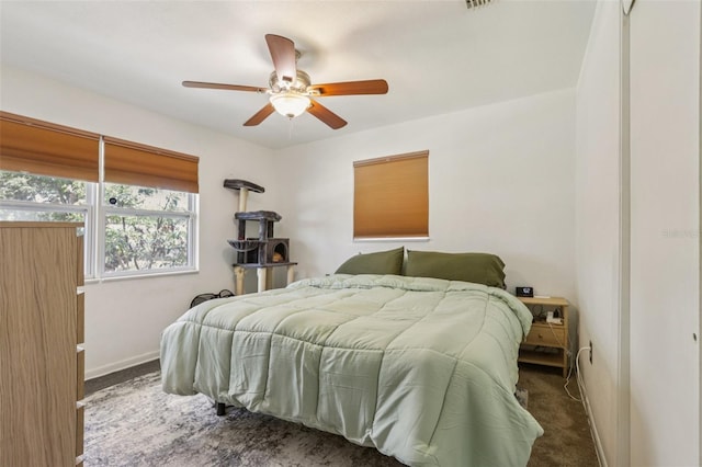 1015 13th Ave NW, Largo, FL 33770 - carpeted bedroom featuring baseboards and ceiling fan
