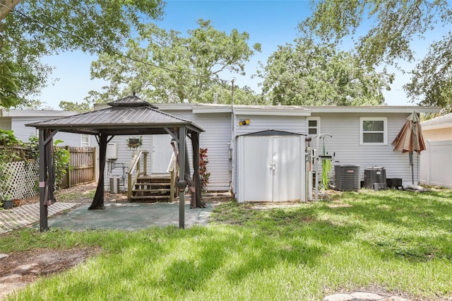 1015 13th Ave NW, Largo, FL 33770 - back of property with a gazebo, a patio area, and a storage unit