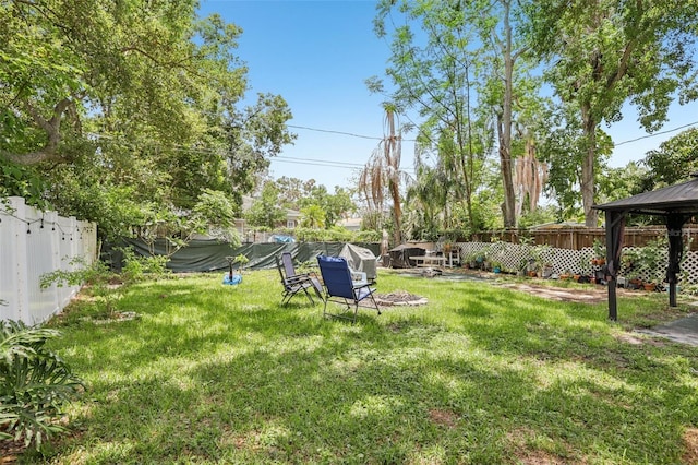 1015 13th Ave NW, Largo, FL 33770 - fenced backyard featuring a gazebo
