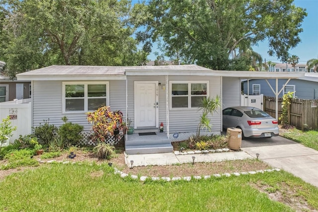 1015 13th Ave NW, Largo, FL 33770 - view of front of home featuring driveway and an attached carport