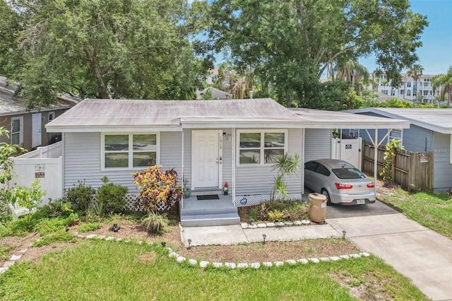 1015 13th Ave NW, Largo, FL 33770 - view of front of property with driveway and a carport