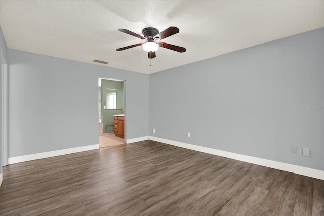 15108 Springview St, Tampa, FL 33624 - unfurnished room with wood finished floors, ceiling fan, baseboards, and a textured ceiling