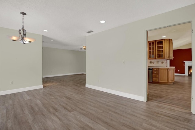 15108 Springview St, Tampa, FL 33624 - unfurnished living room featuring recessed lighting, wood finished floors, baseboards, a chandelier, and ceiling fan