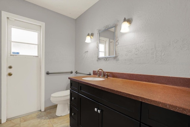 15108 Springview St, Tampa, FL 33624 - bathroom featuring vanity, healthy amount of natural light, toilet, and tile patterned floors