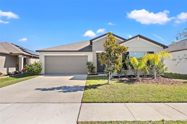 16632 Sunburst Lake St, Wimauma, FL 33598 - view of front facade with a garage, stucco siding, concrete driveway, and a front lawn