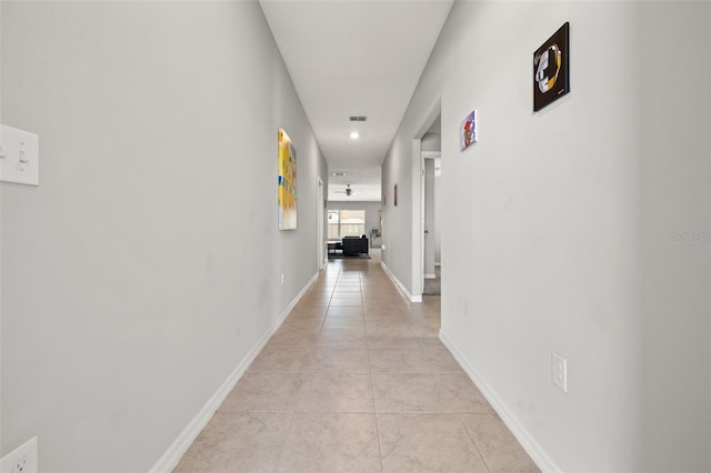 16632 Sunburst Lake St, Wimauma, FL 33598 - hallway with light tile patterned floors, baseboards, and recessed lighting