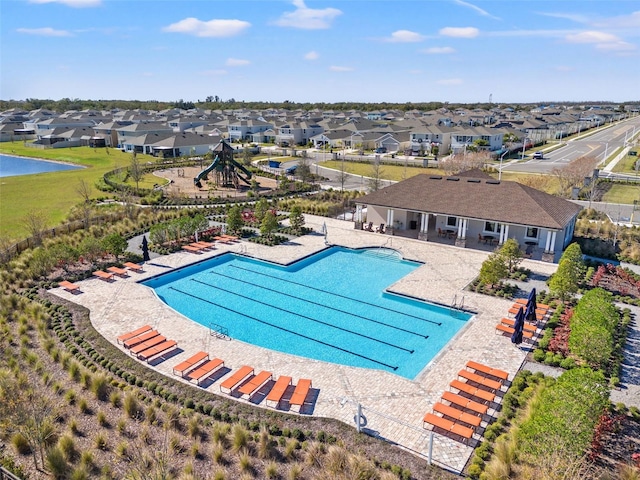 16632 Sunburst Lake St, Wimauma, FL 33598 - community pool with a residential view and a patio area