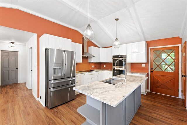 509 Falmouth St, Temple Terrace, FL 33617 - kitchen with appliances with stainless steel finishes, wall chimney range hood, a sink, white cabinets, and wood finished floors