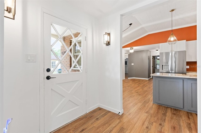 509 Falmouth St, Temple Terrace, FL 33617 - kitchen featuring stainless steel refrigerator with ice dispenser, baseboards, light wood finished floors, light countertops, and gray cabinetry