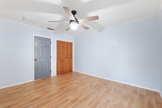 509 Falmouth St, Temple Terrace, FL 33617 - spare room with light wood-style flooring, ceiling fan, baseboards, and crown molding