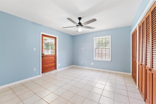 509 Falmouth St, Temple Terrace, FL 33617 - unfurnished bedroom with multiple windows, a closet, baseboards, and a ceiling fan