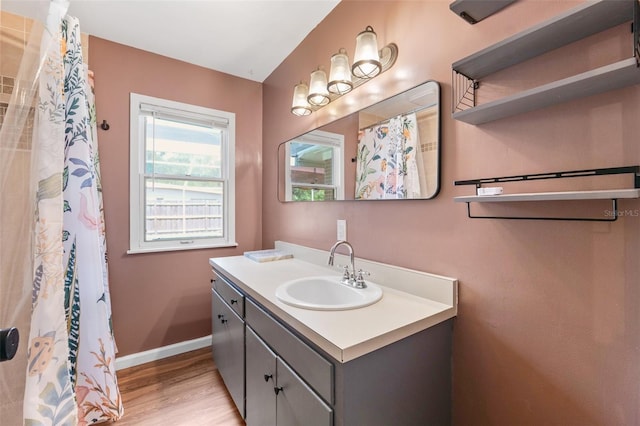 509 Falmouth St, Temple Terrace, FL 33617 - full bath featuring vanity, wood finished floors, baseboards, and curtained shower