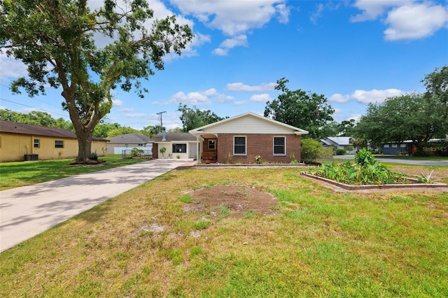 509 Falmouth St, Temple Terrace, FL 33617 - ranch-style house with concrete driveway, a front yard, brick siding, and cooling unit