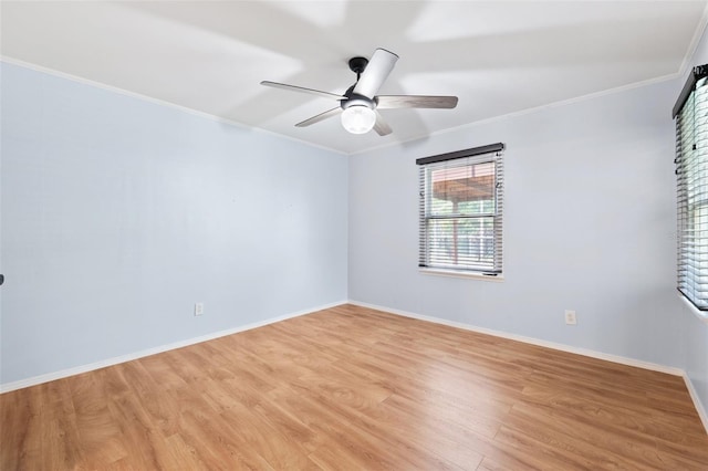 509 Falmouth St, Temple Terrace, FL 33617 - spare room featuring ceiling fan, crown molding, light wood-type flooring, and baseboards