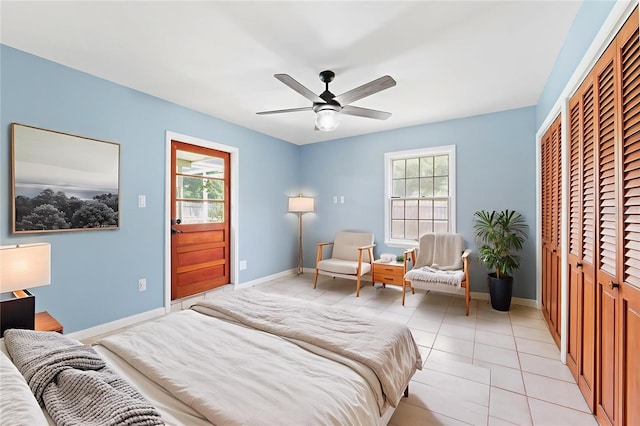 509 Falmouth St, Temple Terrace, FL 33617 - bedroom featuring baseboards, a closet, light tile patterned floors, and ceiling fan