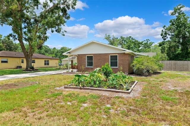 509 Falmouth St, Temple Terrace, FL 33617 - view of front of property with brick siding and a garden