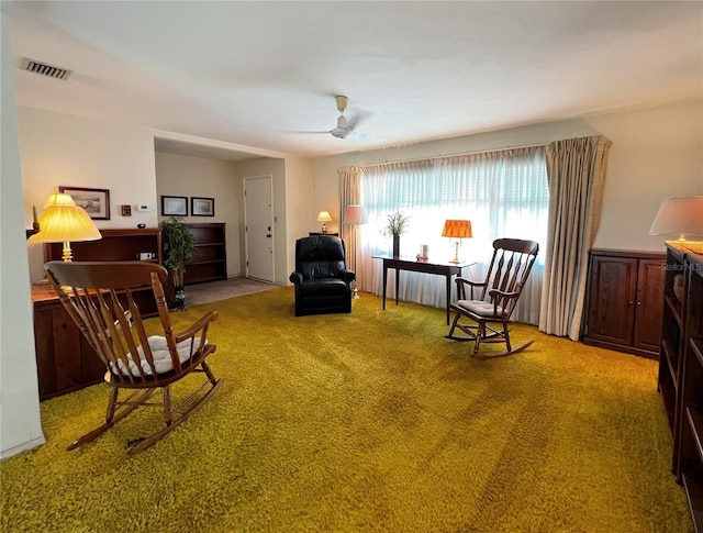 2195 Academy Dr, Clearwater, FL 33764 - living area featuring light colored carpet and ceiling fan