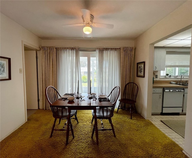 2195 Academy Dr, Clearwater, FL 33764 - dining room with a ceiling fan and light colored carpet