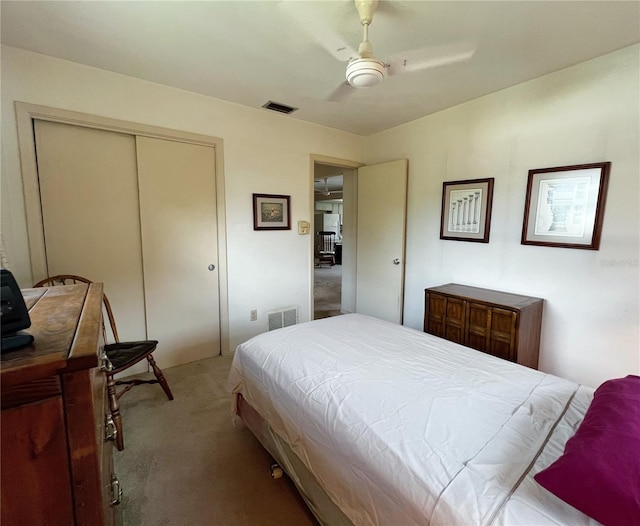2195 Academy Dr, Clearwater, FL 33764 - bedroom with light colored carpet, a closet, and a ceiling fan