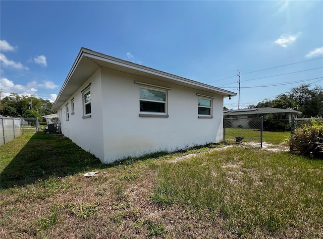 2195 Academy Dr, Clearwater, FL 33764 - view of side of home with stucco siding