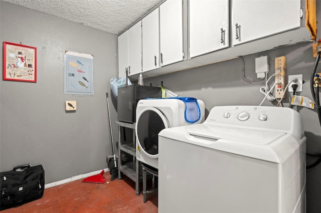 4150 Pecos Dr, New Port Richey, FL 34653 - laundry room featuring cabinet space, washing machine and clothes dryer, baseboards, and a textured ceiling